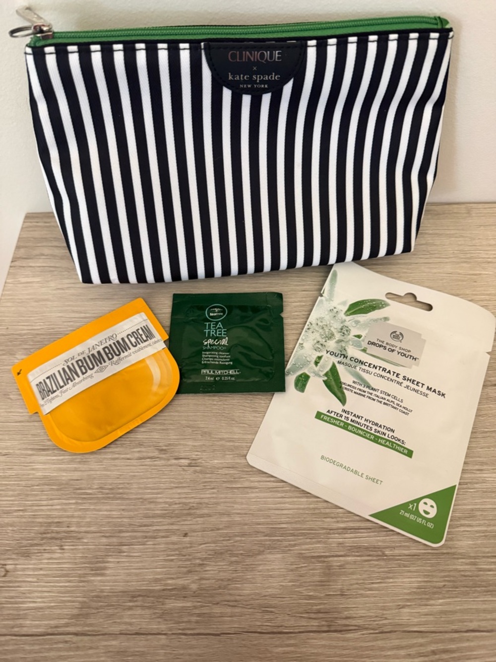 Clinique x kate spade Striped Cosmetic Bag with Sol de Janeiro and more!